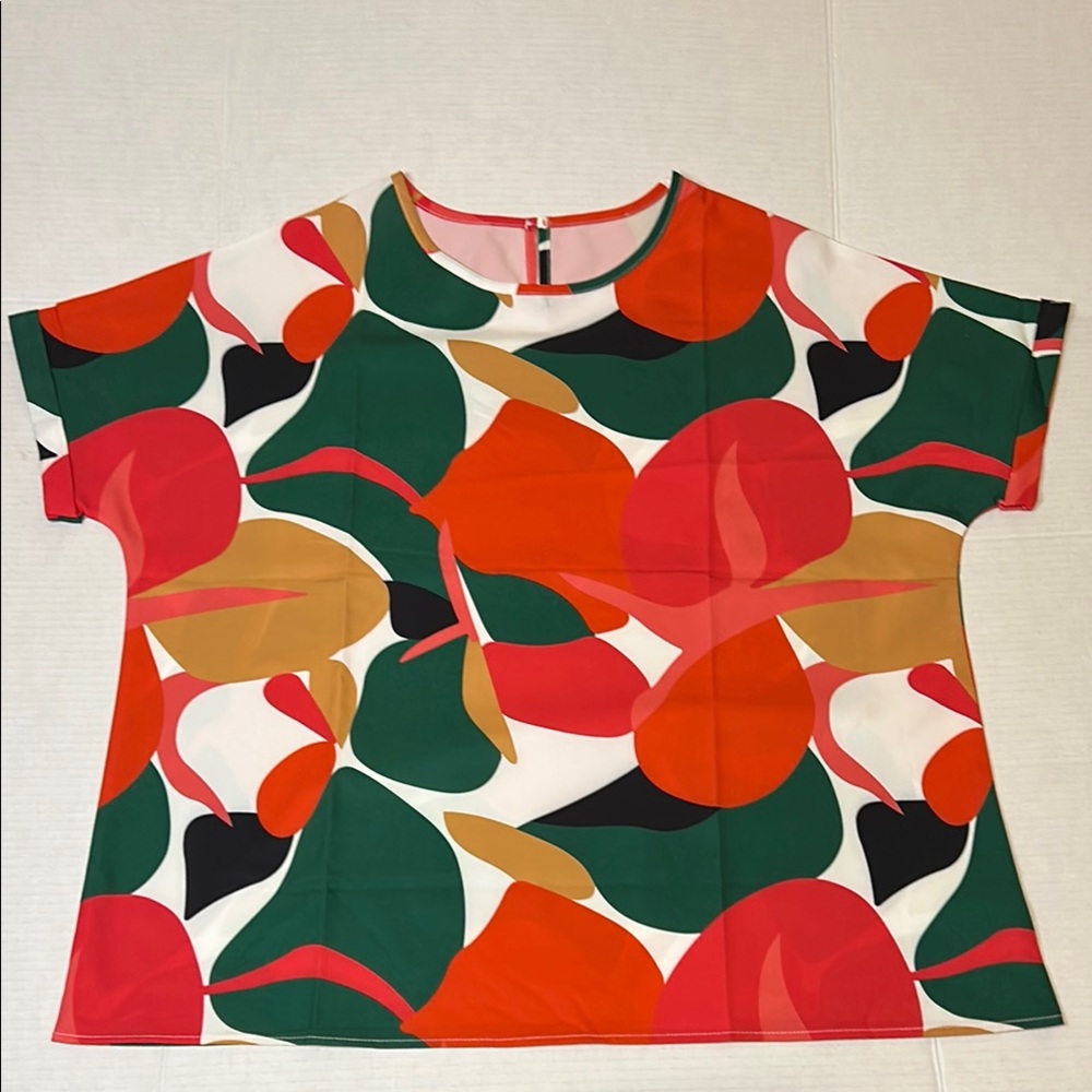 XXL Colorful Abstract Print Top Green, Orange, Black with cuffed cap sleeves.